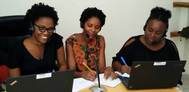 Partnership coordinators Djina Delatour, Julie Cadet-Elize, and Ricarda Germain of SHOPS Plus record a weekly radio show in the project’s Port-au-Prince office using Skype.